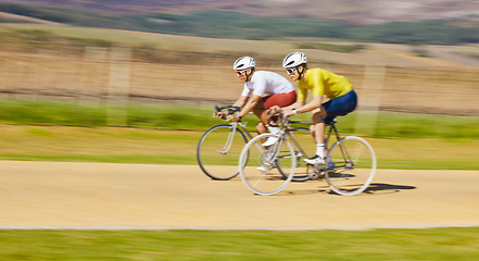 Image showing Fitness, countryside or men cycling on a bicycle for training, cardio workout or race exercise together. Speed blur, healthy friends or sports athletes riding a bike off road or path for challenge