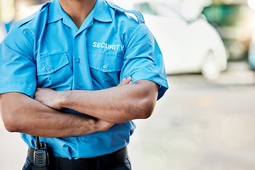 Image showing Security guard, safety officer and man with arms crossed outdoor on street for protection and patrol. Law enforcement, confident and duty with a crime prevention male worker in uniform in the city