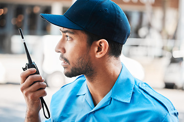 Image showing Security guard, safety officer or man on walkie talkie on a street for protection, patrol or watch. Law enforcement, serious and communication with crime prevention male worker in uniform in the city