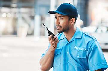 Image showing Security guard, communication and officer use a walkie talkie or radio for an emergency or criminal investigation. Protection, safety and police talking in a law enforcement service office for crime