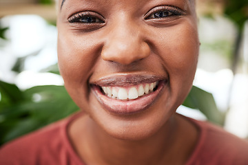 Image showing Portrait, plants and teeth with a black woman gardener in her home for sustainability or green growth. Face, flare and smile with a happy young female person in a nursery for eco friendly gardening