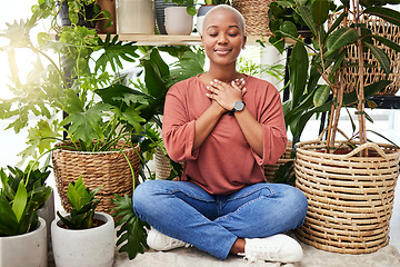 Image showing Peace, breathe and calm woman by plants for meditation exercise in a greenery nursery. Health, gratitude and young African female person with a relaxing zen mindset by an indoor greenhouse garden.
