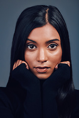 Image showing Face, beauty touch and confidence of woman in studio isolated on a gray background. Serious portrait, natural skincare and Indian model with facial treatment for aesthetic, cosmetics and wellness