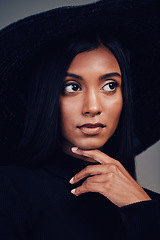 Image showing Fashion, woman in hat and beauty, thinking with makeup and elegance, glamour with luxury on studio background. Designer clothes, black aesthetic and female model with vintage style and cosmetic shine