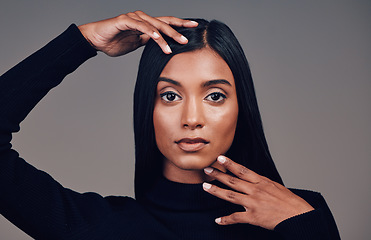 Image showing Face, beauty and skincare of confident woman in studio isolated on a gray background. Serious portrait, natural and Indian model with spa facial treatment for aesthetic, healthy skin and cosmetics.