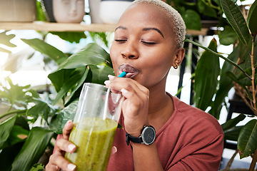 Image showing Health, diet and drink with black woman and smoothie for detox, breakfast and protein. Nutrition, food and weight loss with face of person and glass for green juice, vitamins and supplement