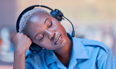 Image showing Tired, call center and black woman sleeping with headset during telemarketing work at night. Contact us, burnout and African customer service employee with fatigue while in an office for consulting