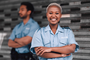 Image showing Portrait, security or law enforcement and a happy black woman arms crossed with a man colleague on the street. Safety, smile and duty with a crime prevention unity working as a team in an urban city