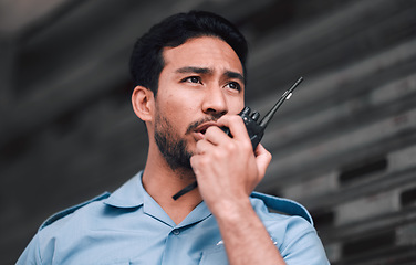 Image showing Walkie talkie, security guard or safety officer man outdoor for protection, patrol or watch. Law enforcement, transceiver and duty with a crime prevention male worker in uniform with communication