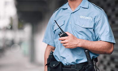 Image showing Walkie talkie, security guard or safety officer man on the street for protection, patrol or watch. Law enforcement, hand and duty with a crime prevention male worker in uniform in the city