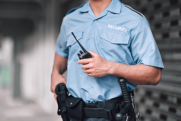 Image showing Security guard, safety officer and man with walkie talkie in hand on street for protection, patrol or watch. Law enforcement, focus and duty with a crime prevention male worker in uniform in the city