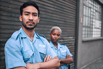 Image showing Portrait, security or law enforcement and a serious man arms crossed with a black woman colleague on the street. Safety. focus and duty with a crime prevention unity working as a team in the city