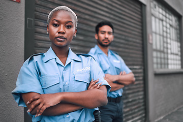 Image showing Portrait of black woman, security guard or arms crossed of safety officer, protection service or team patrol in city. Law enforcement, focus or professional crime prevention people in uniform outdoor