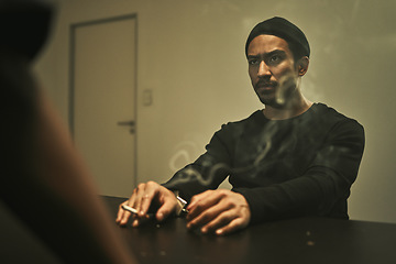 Image showing Man in investigation, smoking and detective in interrogation room with criminal, suspect or interview with a gangster. Police officer, questioning and statement of truth and person with cigarette