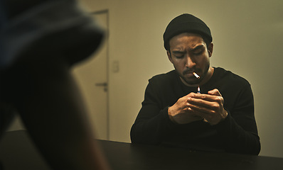 Image showing Man, smoking and talking to police detective in interrogation room with criminal, suspect or interview with a gangster. Security, officer and questioning a person in conversation and investigation