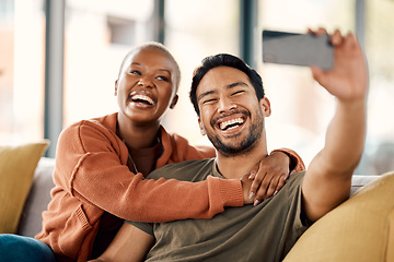 Image showing Home, selfie and couple on a couch, smile and loving together with romance, profile picture and marriage. Social media, black woman or Asian man on a sofa, romantic and memory with happiness or relax