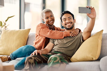 Image showing Home, selfie and couple on a couch, love and happiness with romance, relationship and marriage. Social media, black woman and Asian man on a sofa, romantic and memory with profile picture and relax