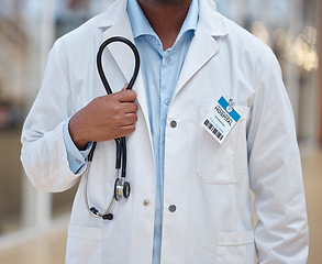 Image showing Doctor, person and closeup with stethoscope in hospital for healthcare analysis, consulting and professional service. Cardiology surgeon, therapist and expert in medicine with medical tools in clinic