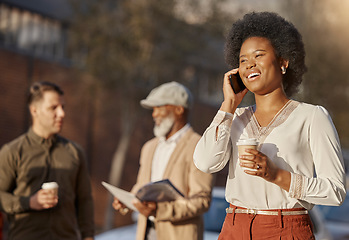 Image showing Phone call, coffee and a business black woman in town for communication on her morning commute. Mobile, contact and travel with a happy young female employee walking outdoor in an urban city