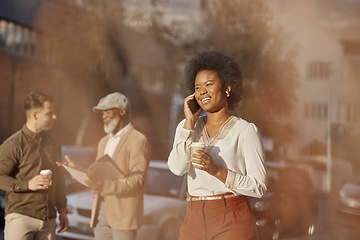 Image showing Phone call, coffee and a business black woman in the city for communication on her morning commute. Mobile, contact and travel with a happy young female employee walking outdoor in an urban town