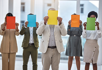 Image showing Collaboration, paper and an anonymous business team standing in the office together to show selection options. Teamwork, mockup and color poster with a group of colleagues or employees at work