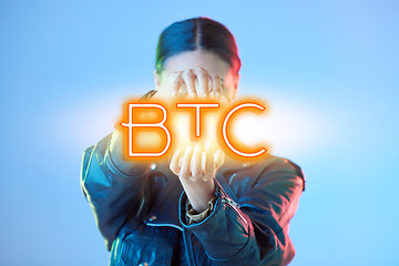 Image showing Woman, hologram and btc with finance, business and promotion against a blue studio background. Female person, investment and model with a sign, financial and symbol for trading with profit growth