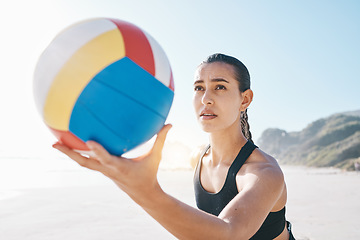 Image showing Beach, exercise and woman with volleyball to serve for games, fun and sports in sunshine. Face of female person, athlete and player with focus holding ball to start contest for summer action at ocean