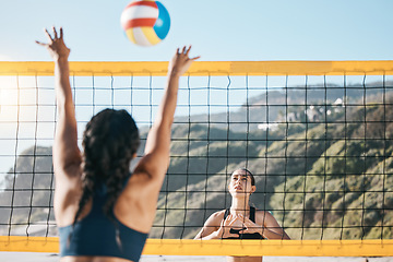 Image showing Volleyball, women and spike, net with sports and fitness outdoor, playing game at the beach at summer. Exercise, female athlete and match with ball and active, workout and action with tournament