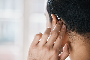 Image showing Hearing aid, face and ear of man with disability from the back on mockup space. Closeup of deaf person, medical device or implant of sound waves, audiology or help of listening equipment for wellness