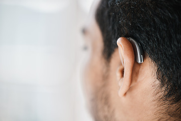 Image showing Hearing aid, closeup or ear of man with disability from the back on mockup space. Deaf person, medical device or implant of sound waves, audiology or help of listening equipment, accessory or support