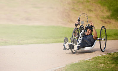 Image showing Cycling, nature and speed, man with disability training for competition with motivation and exercise on bike. Motion, workout and person on fast recumbent bicycle for outdoor race, space and mockup.