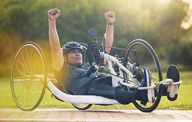 Image showing Cycling, winning and happy man with disability, competition training with success and exercise champion on bike. Happiness, workout and celebration, person on recumbent bicycle and winner of race.