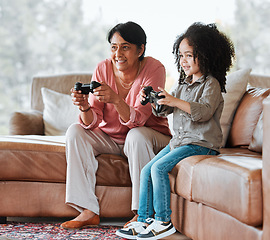 Image showing Grandma, child and video game on couch, controller and happy together with bond, contest and love in lounge. Senior woman, young kid and playing with gaming, esports and competition in family house