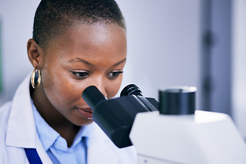 Image showing Closeup of black woman scientist, microscope with analysis and science study for medical research and biotechnology in lab. Female person, doctor and check test sample and scientific experiment