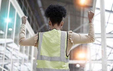 Image showing Woman, success or architect in celebration of deal for industrial property or real estate with hands up. Back view, winner or happy designer with goals, target or achievement for engineering growth