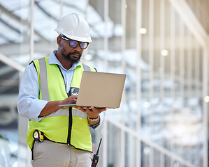 Image showing Architecture, research and laptop with black man in warehouse for engineering, building and design. Technology, planning and digital with contractor focus for project management and graphic