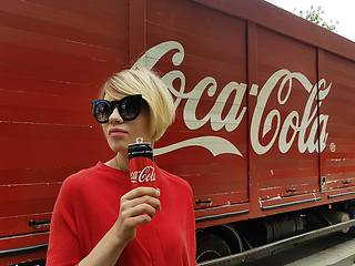 Image showing Kyiv, Ukraine - July 6, 2017 Beautiful fashionable woman with model release drinking Coca-Cola soda