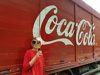 Image showing Kyiv, Ukraine - July 6, 2017 Beautiful fashionable woman with model release drinking Coca-Cola soda