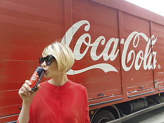 Image showing Kyiv, Ukraine - July 6, 2017 Beautiful fashionable woman with model release drinking Coca-Cola soda