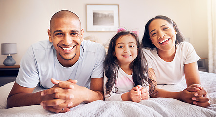 Image showing Family, relax and portrait on a bed at home while happy and together for quality time. Man, woman or hispanic parents and a girl kid in the bedroom for morning bonding with love, security and care