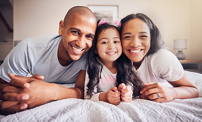 Image showing Family, portrait and relax on a bed at home with a smile and comfort for quality time. Man, woman or hispanic parents and a girl kid together in the bedroom for morning bonding with love and care