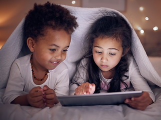 Image showing Games, night and children with a tablet in bed for cartoon, movie or streaming a show. Smile, blanket and girl kids with technology in the bedroom for the internet, education or online fun together