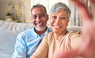 Image showing Selfie, home and senior couple with love, relax and happiness with romance, bonding and marriage. Portrait, old man and elderly woman on a couch, social media and profile picture with a relationship