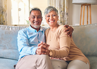 Image showing Senior couple, portrait and holding hands on sofa in home living room, bonding and love. Smile, elderly man and happy woman relax with romance, care and enjoying retirement together in house lounge.