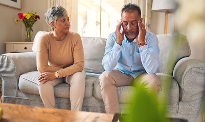 Image showing Senior couple, argument and divorce in stress, conflict or fight from disagreement on living room sofa at home. Elderly man and woman in depression, infertility or toxic relationship in the house