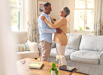 Image showing Love, romance and dance with a senior couple in the living room of their home together for bonding. Marriage, retirement or bonding with an elderly man and woman dancing in the lounge of their house