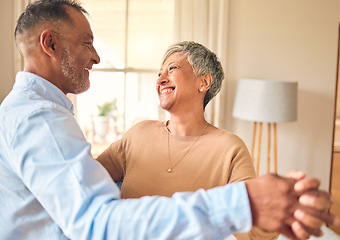 Image showing Love, marriage and dance with a senior couple in the living room of their home together for bonding. Romance, retirement or bonding with an elderly man and woman dancing in the lounge of their house