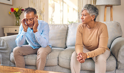 Image showing Senior couple, stress and divorce in fight, conflict or argument for disagreement on living room sofa at home. Elderly man and woman in depression, infertility or toxic relationship in the house