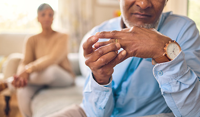 Image showing Elderly couple, hands and ring in divorce, fight or conflict from disagreement or argument on sofa at home. Senior man and woman in depression, infertility or cheating and toxic marriage in the house