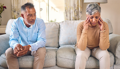 Image showing Senior couple, divorce and fight in conflict, argument or disagreement on living room sofa at home. Elderly man and frustrated woman in depression, infertility or toxic relationship in the house